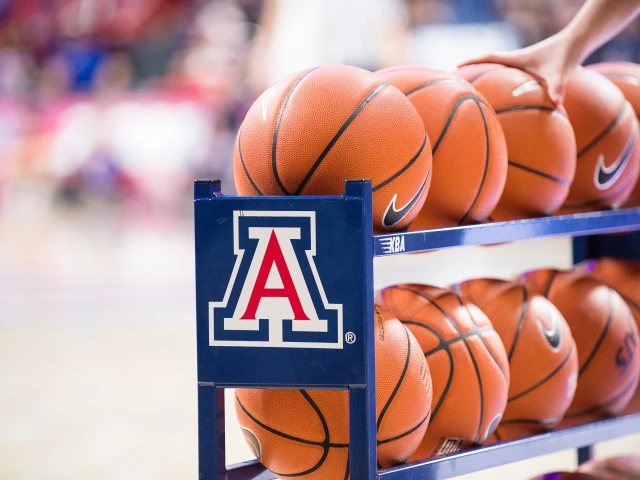 A hand grabbing basketballs from a "Block A" rack