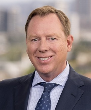 Portrait of man in business attire with soft focus background