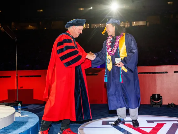 Student receiving award at Commencement