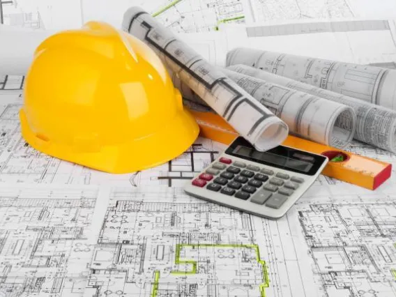 Hardhat, calculator and blueprints