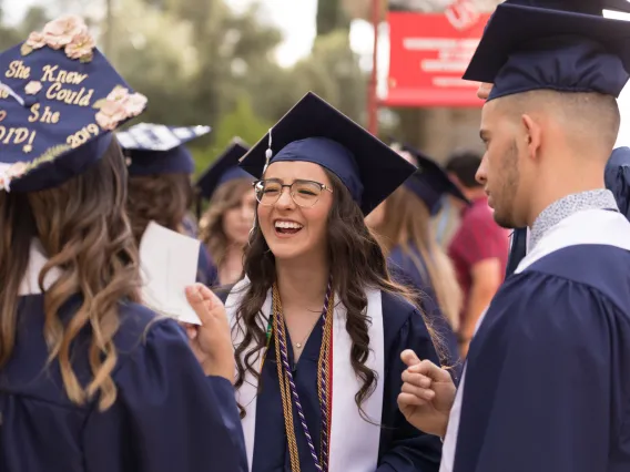 Students in graduation cap and gown