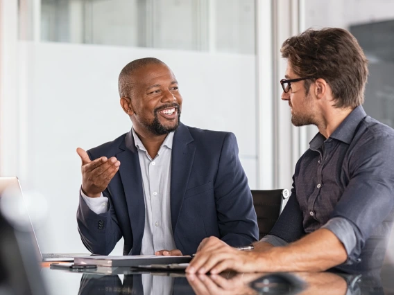 Two people talking in an office