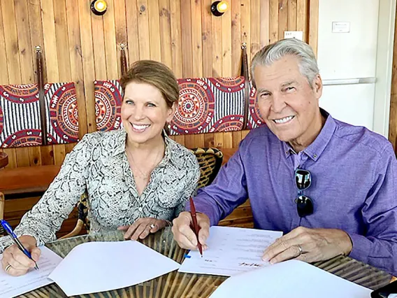 Man and woman signing papers