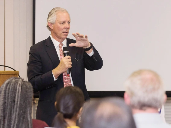 President Robbins speaking to group