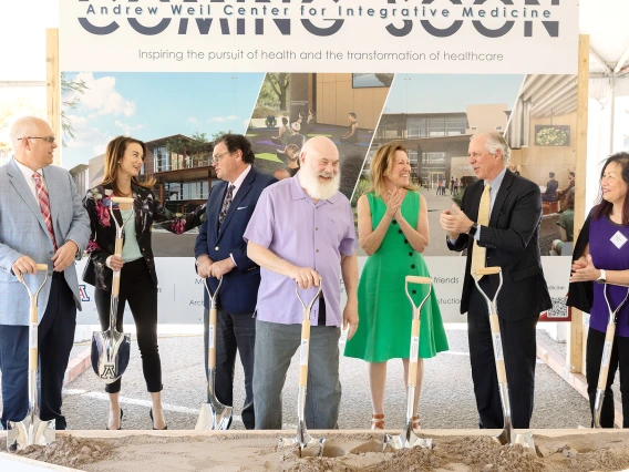 Group of people with shovels at a groundbreaking ceremony