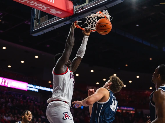 UA basketball player slam dunk