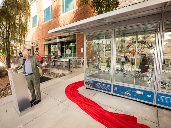 University of Arizona President Robert C. Robbins in front of the display