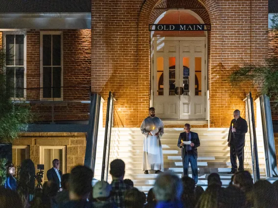 A candlelight vigil on the steps of Old Main