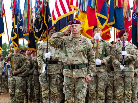 Photo of Army Major General Chris Laneve '89 saluting.