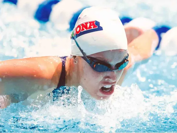 Swimmer races through water