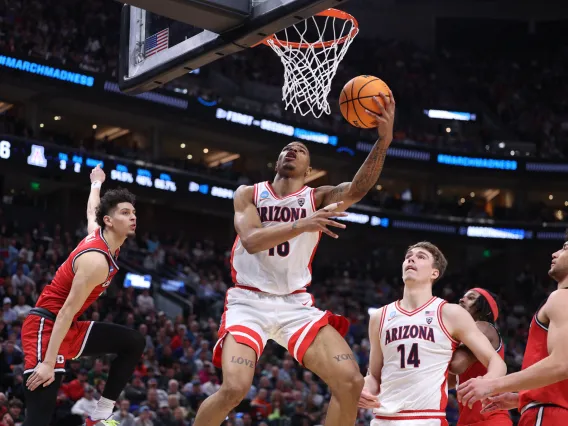 Keshad Johnson lays in 2 points while teammate Motiejus Krivas looks on vs. Dayton in the NCAA Tournament