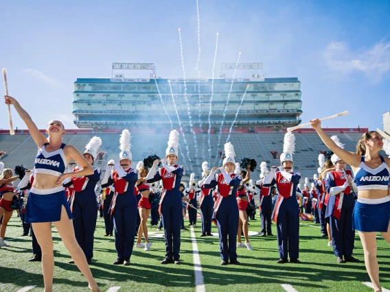 A photo of the Pride of Arizona performing in Arizona stadium.