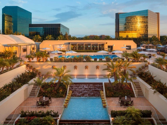 The Westin Hotel overlooking a long pool 