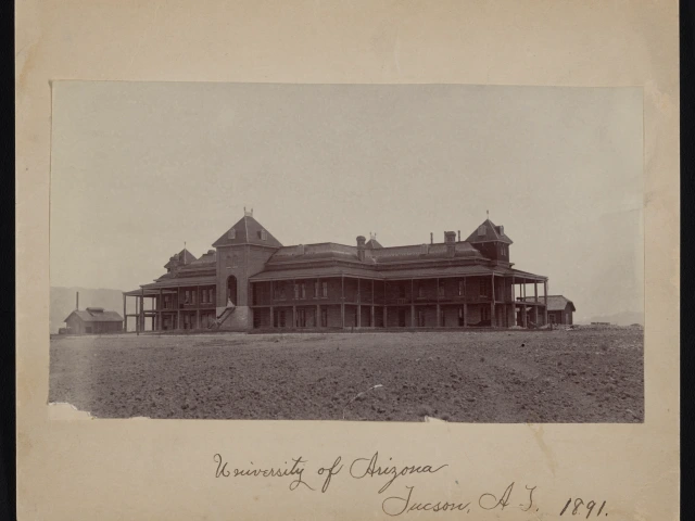 A photograph of Old Main, surrounded by an arid environment, with the words "University of Arizona Tucson, AZ 1891" written in cursive at the bottom. 