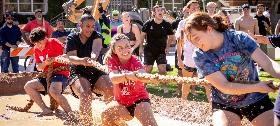 Students participating in Mud Tug-of-War