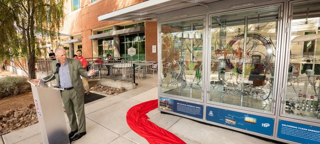 University of Arizona President Robert C. Robbins in front of the display