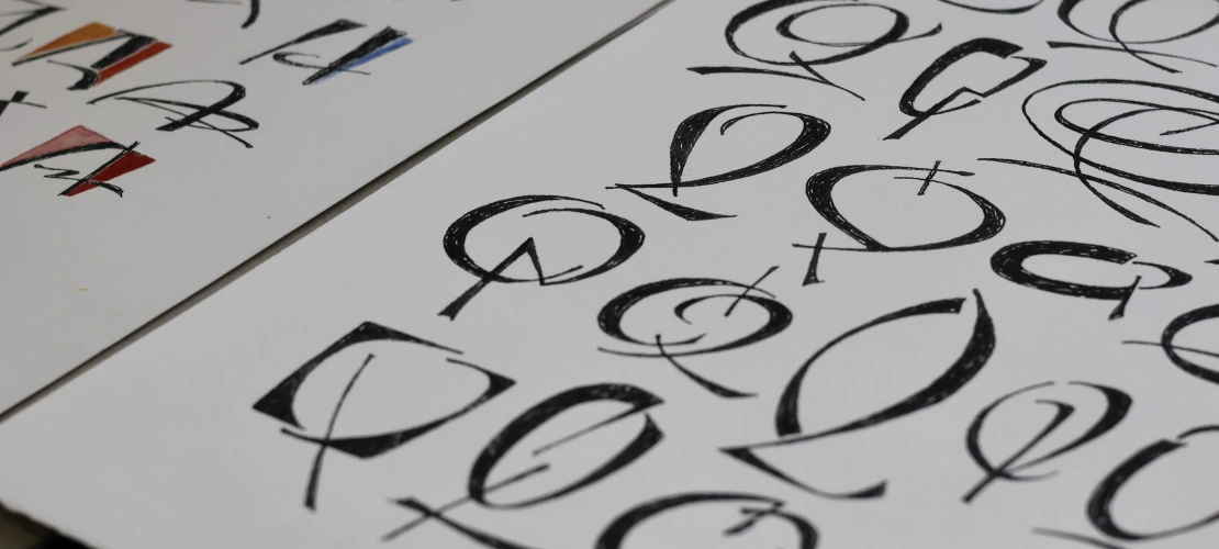 A page from the book Rescuing Q: Quandaries and Queries by Suzanne Moore of rows of stylized letter Qs