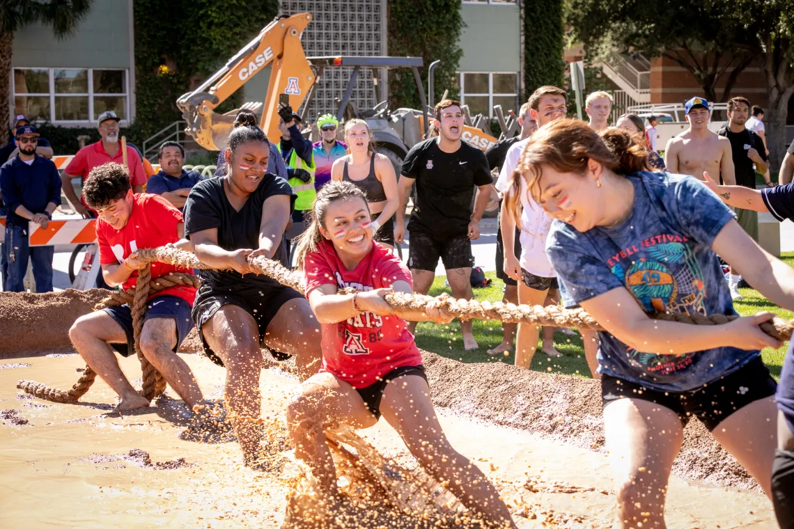 Students participating in Mud Tug-of-War