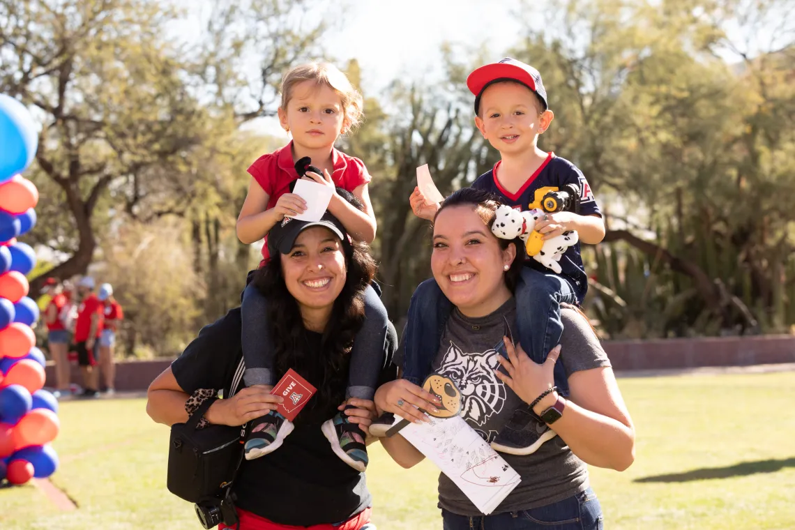 Moms with kids on shoulders