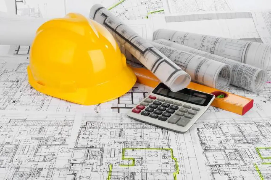 Hardhat, calculator and blueprints