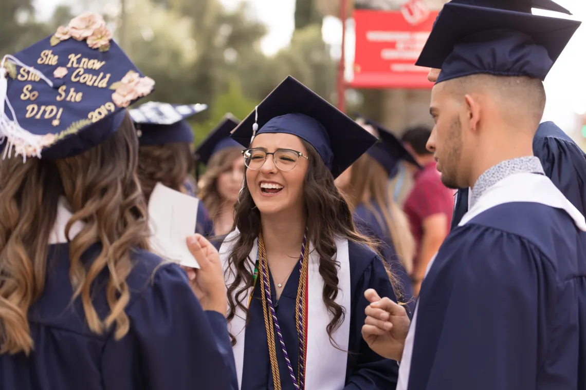 Students in graduation cap and gown