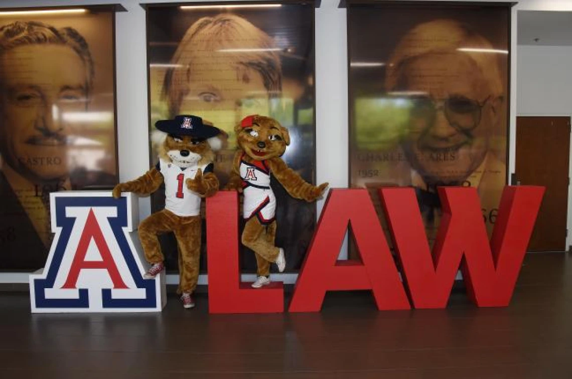 Wilbur and Wilma standing at a sign that says LAW