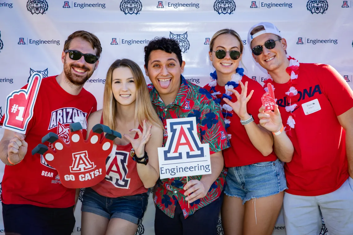 Group of people in Wildcat gear holding Engineering sign