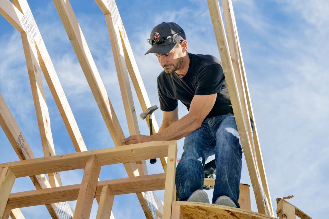Man building a house frame