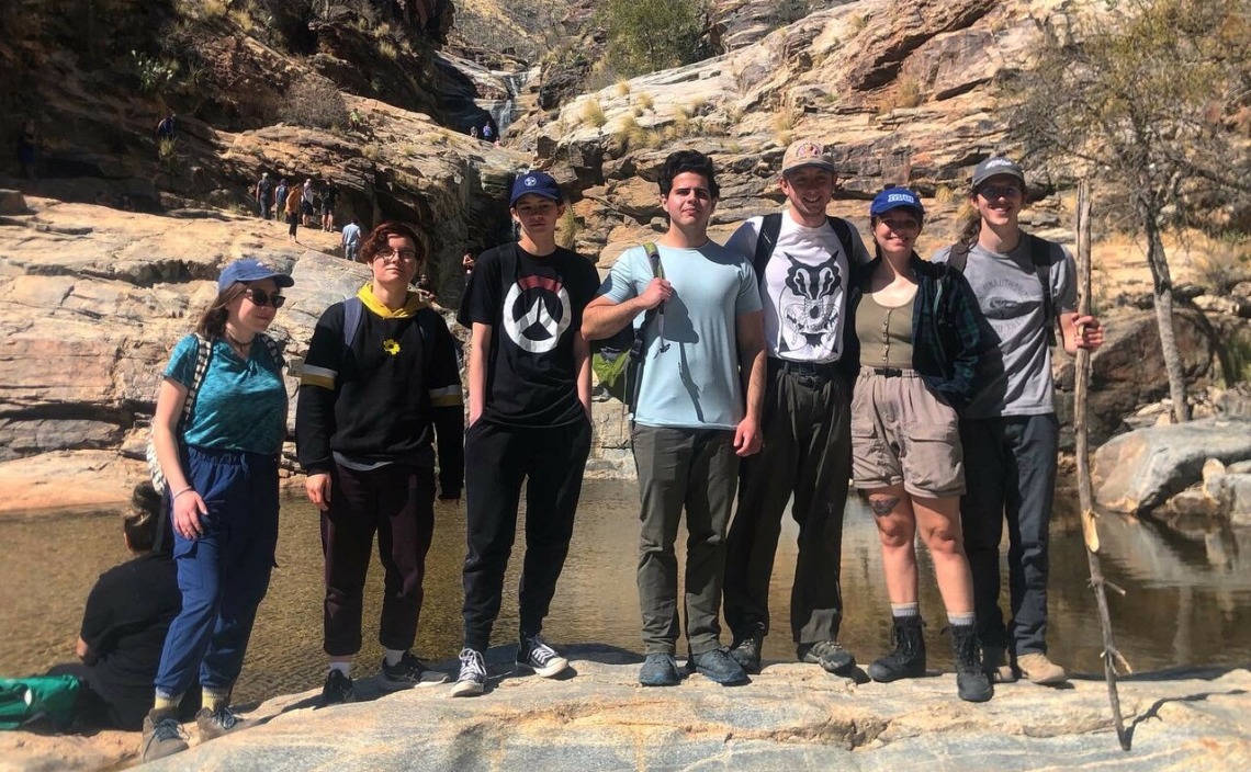 Group of hikers in front of river