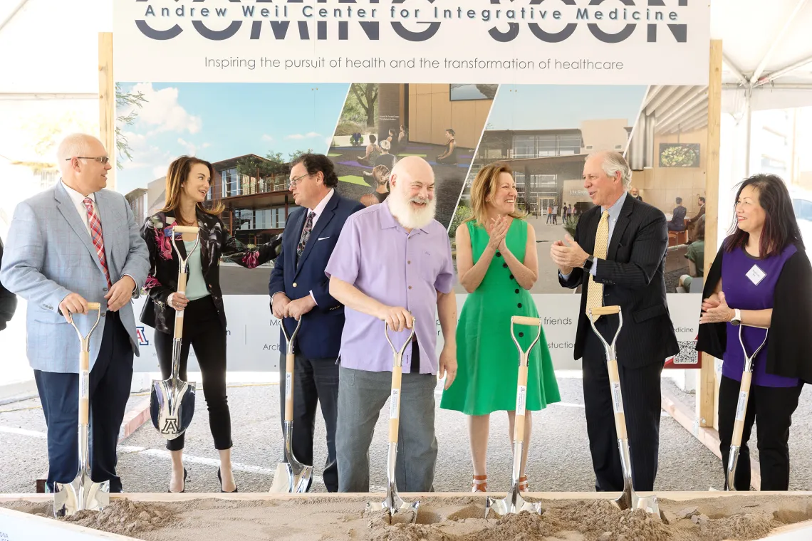 Group of people with shovels at a groundbreaking ceremony