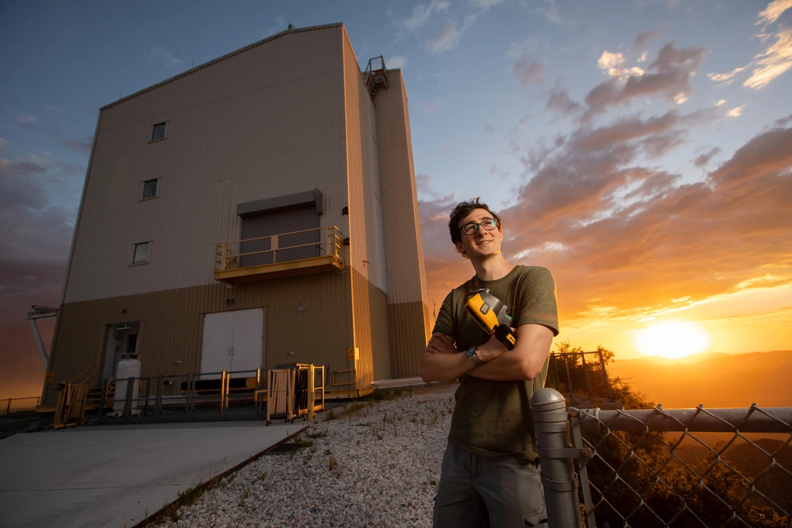 Student standing in front of a building