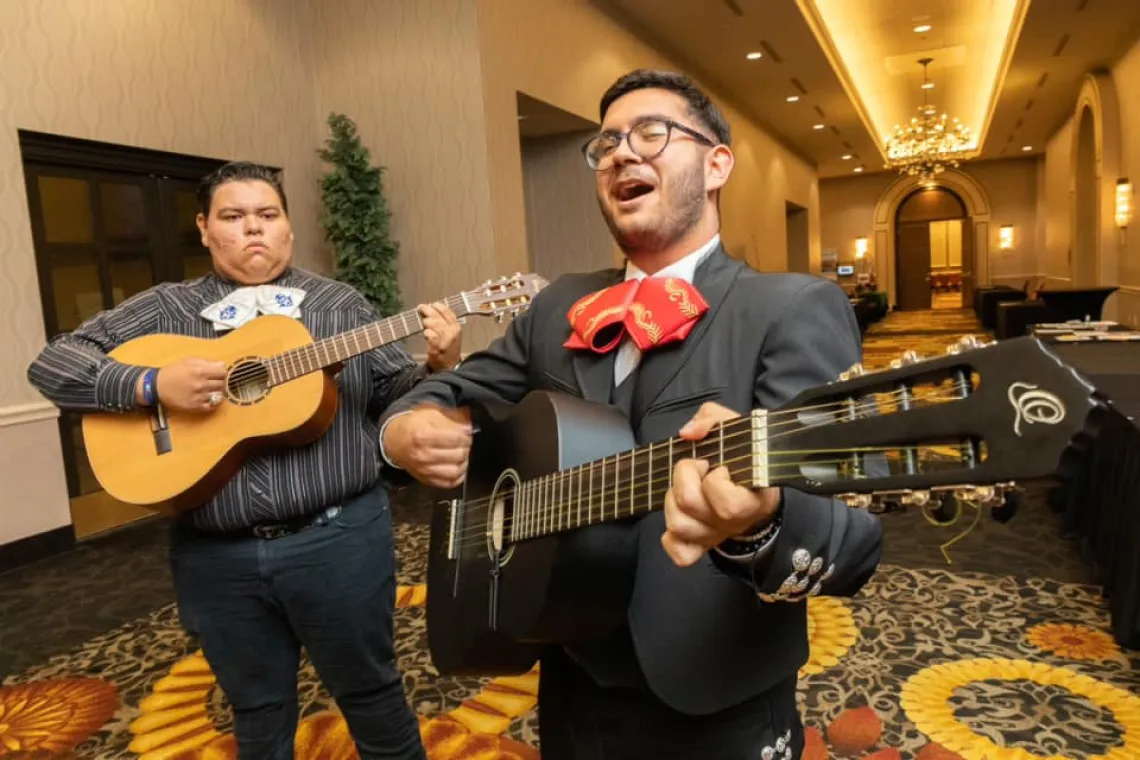 Guitarists playing and singing