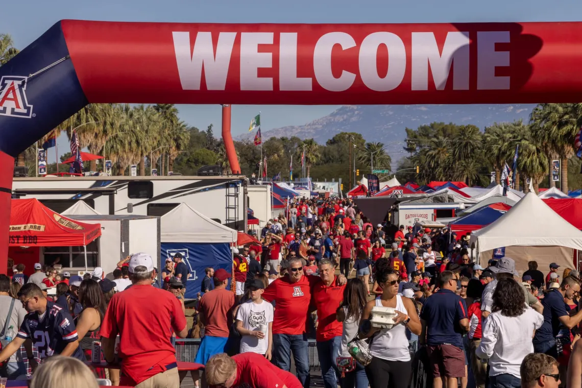 Welcome sign at the Wildcat for Life Tailgate with a large crowd