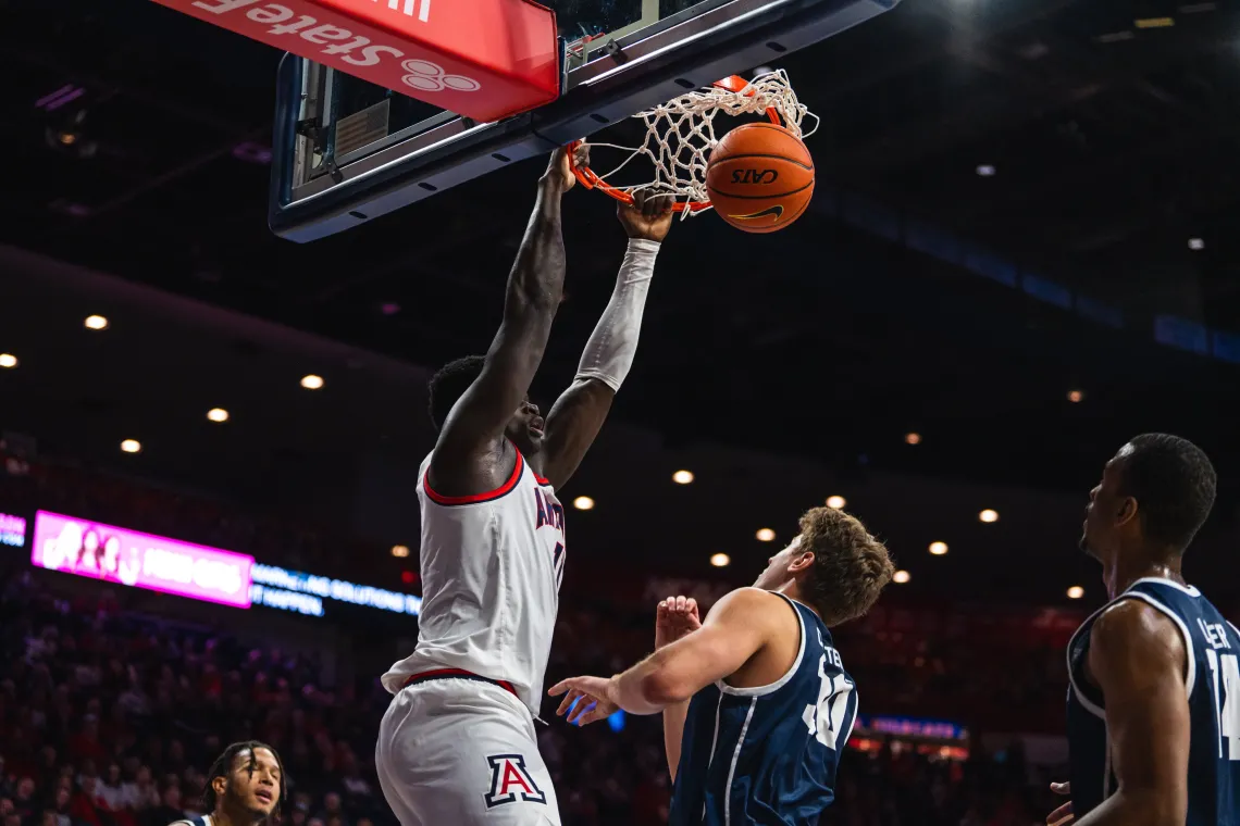 UA basketball player slam dunk