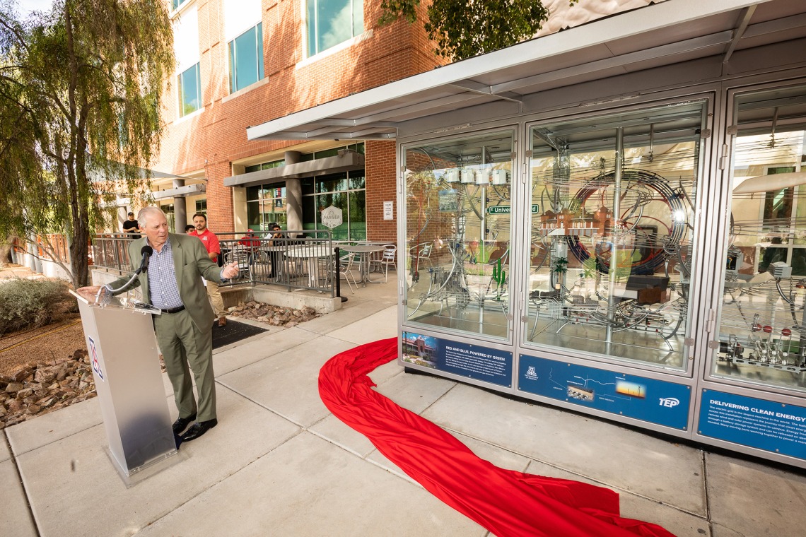 University of Arizona President Robert C. Robbins in front of the display