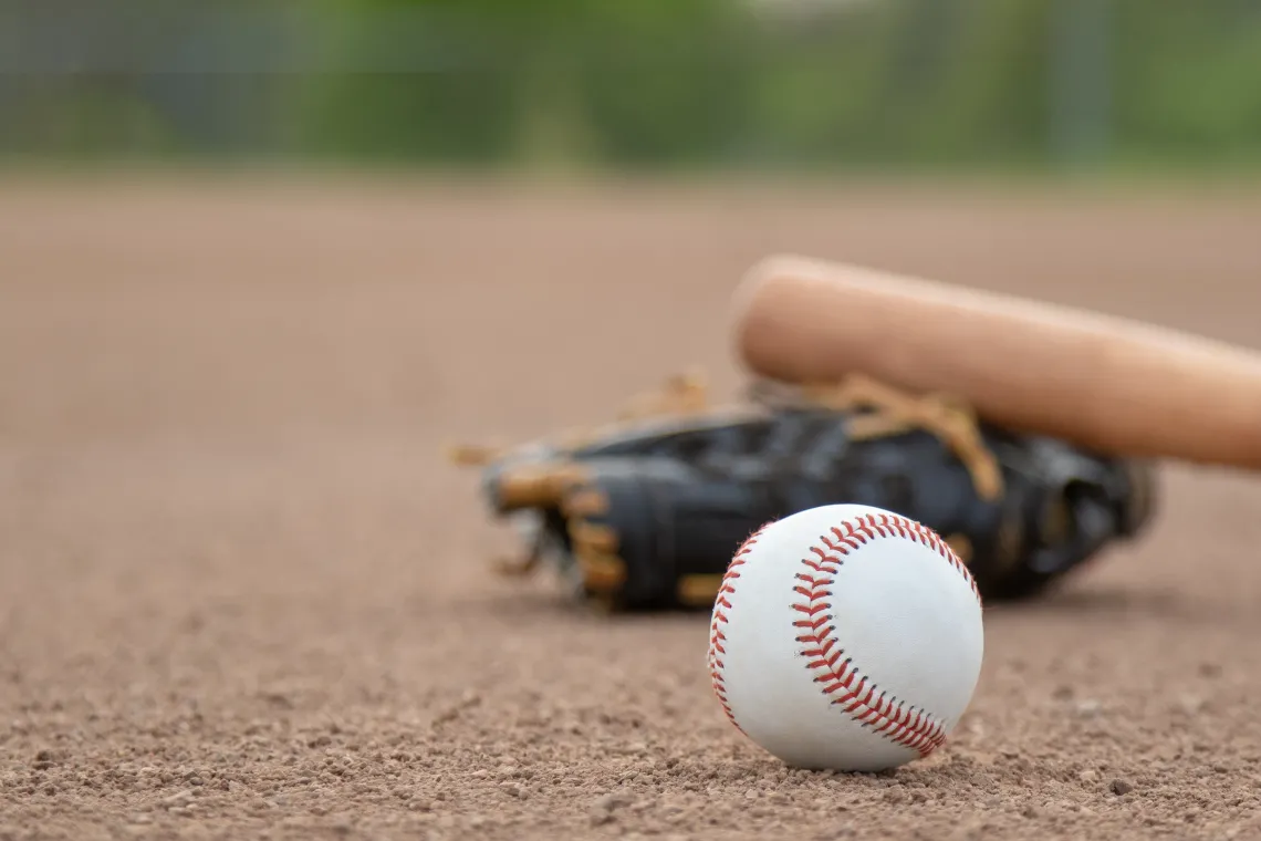 Photograph of baseball gear on a field