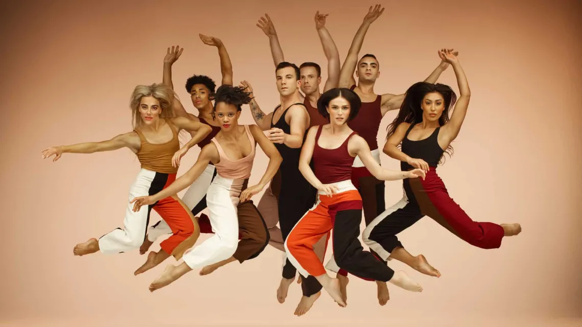 A photograph of dancers posing in the air