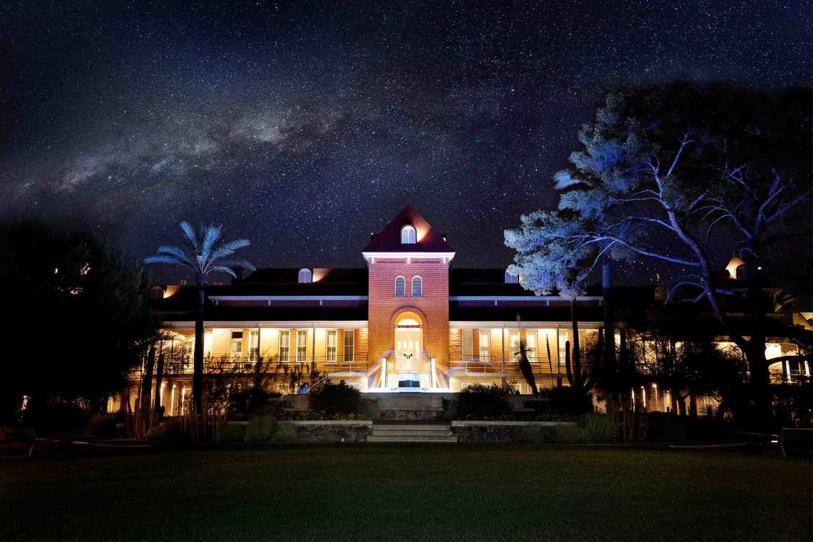 Old main against the backdrop of the night sky showing the milky way