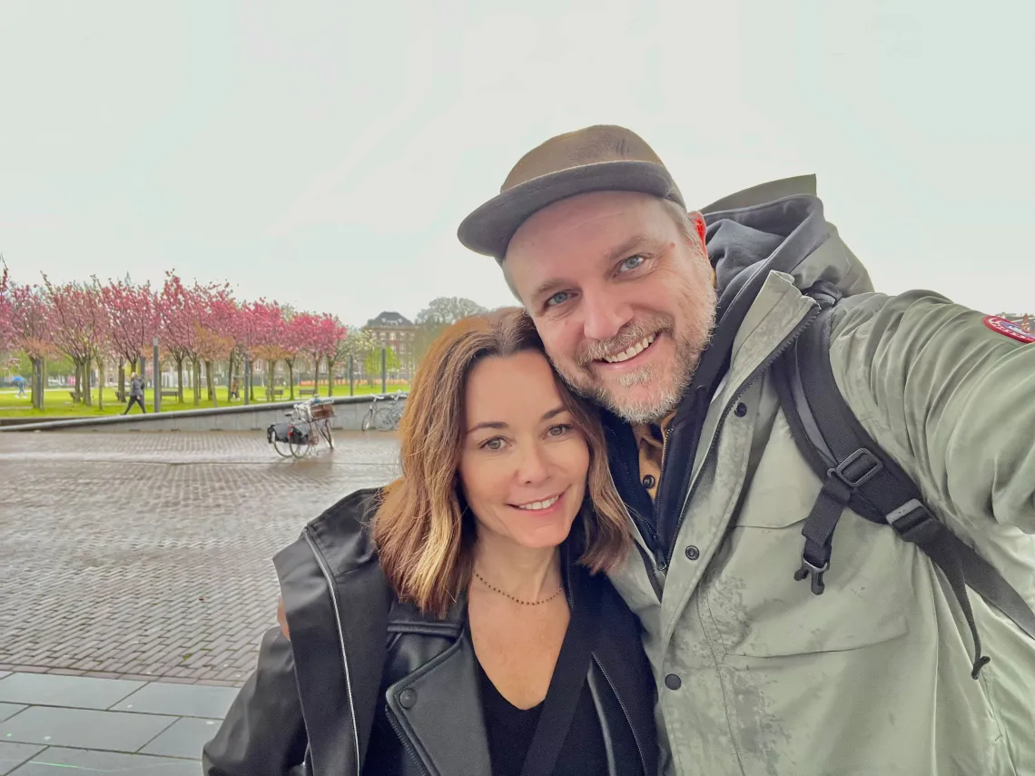 Woman and man smile in selfie style photo