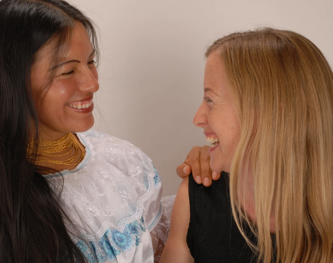Laura and Virginia smiling at each other 