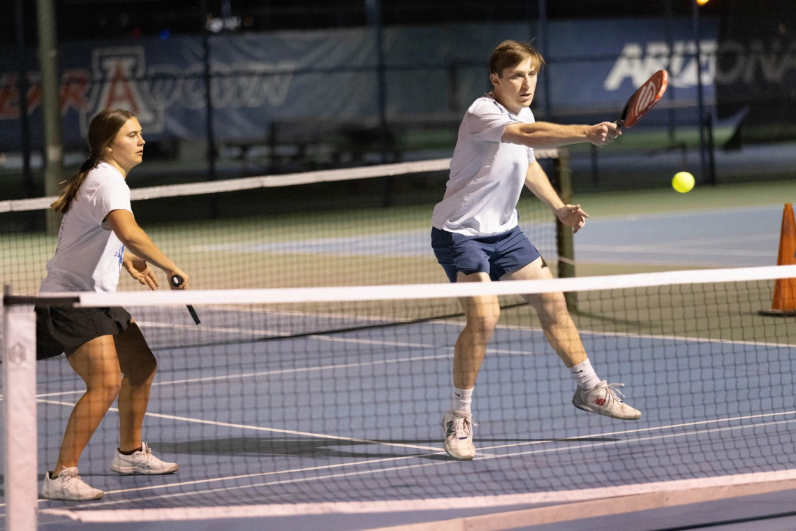 Two players working together on the court 