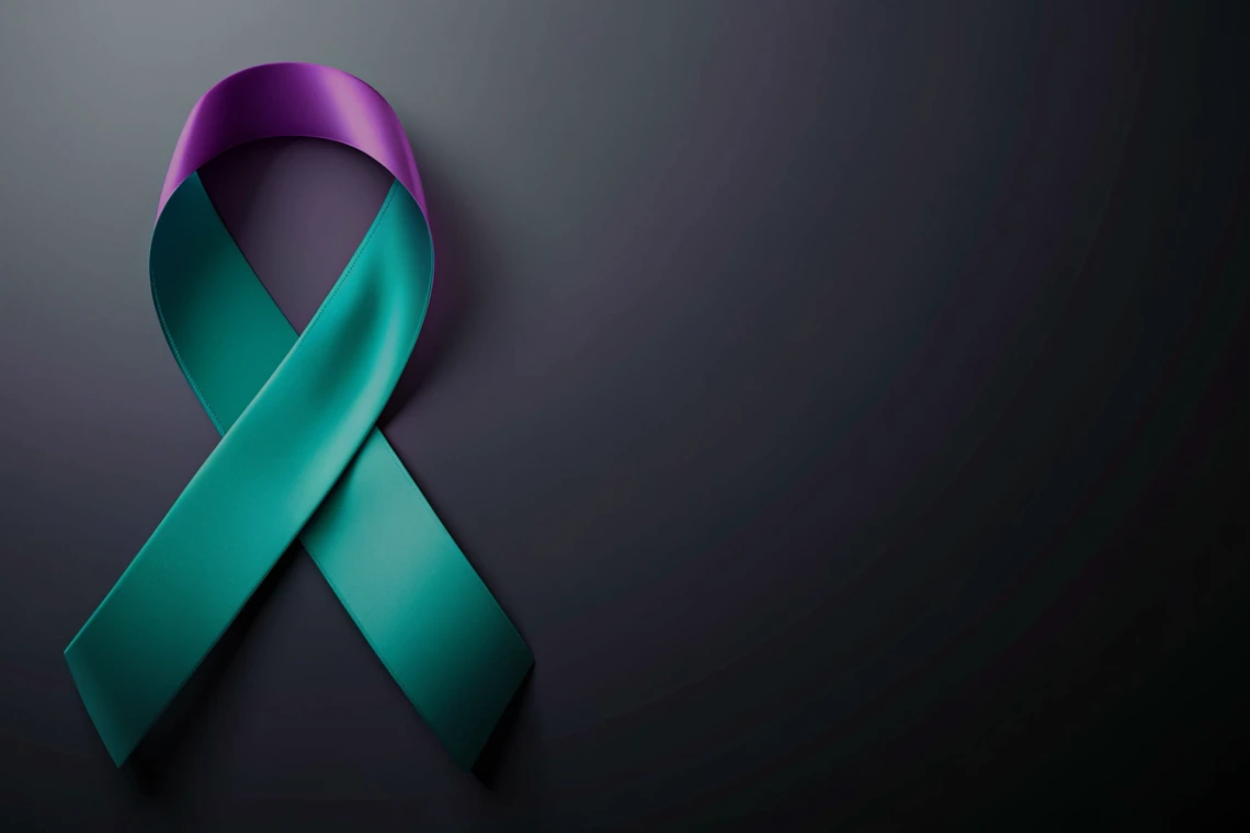 An image of the green and purple suicide prevention ribbon.