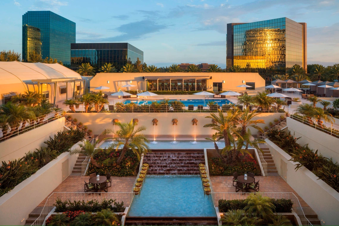 The Westin Hotel overlooking a long pool 