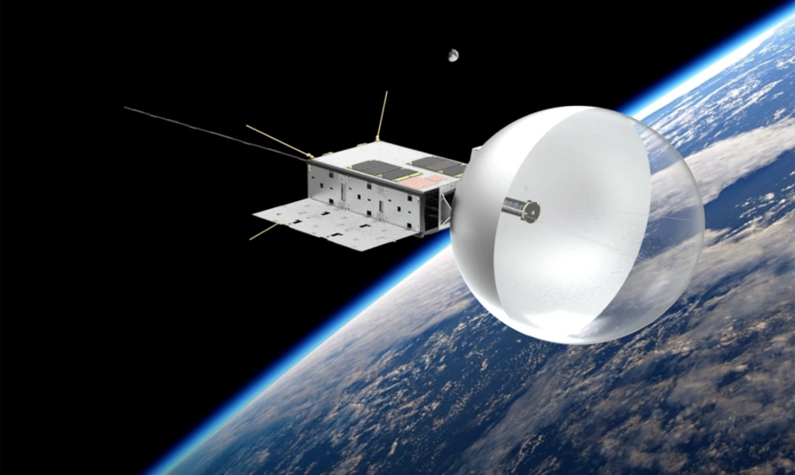 Illustration of the CatSat satellite in low Earth orbit, featuring a deployed balloon-like drag sail, Earth’s curved horizon, and a distant moon.