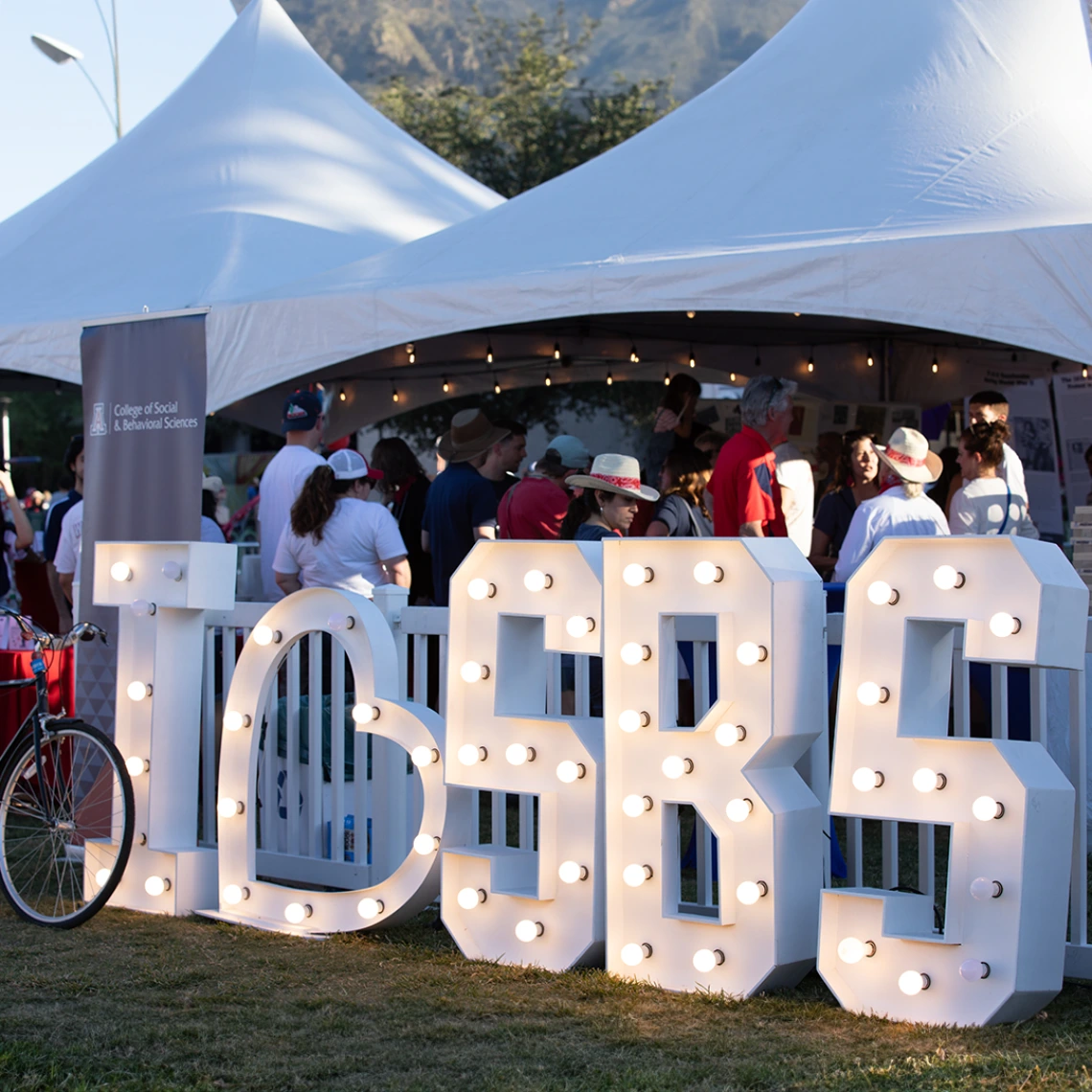 Tents with a giant white sign that says "I Heart SBS"
