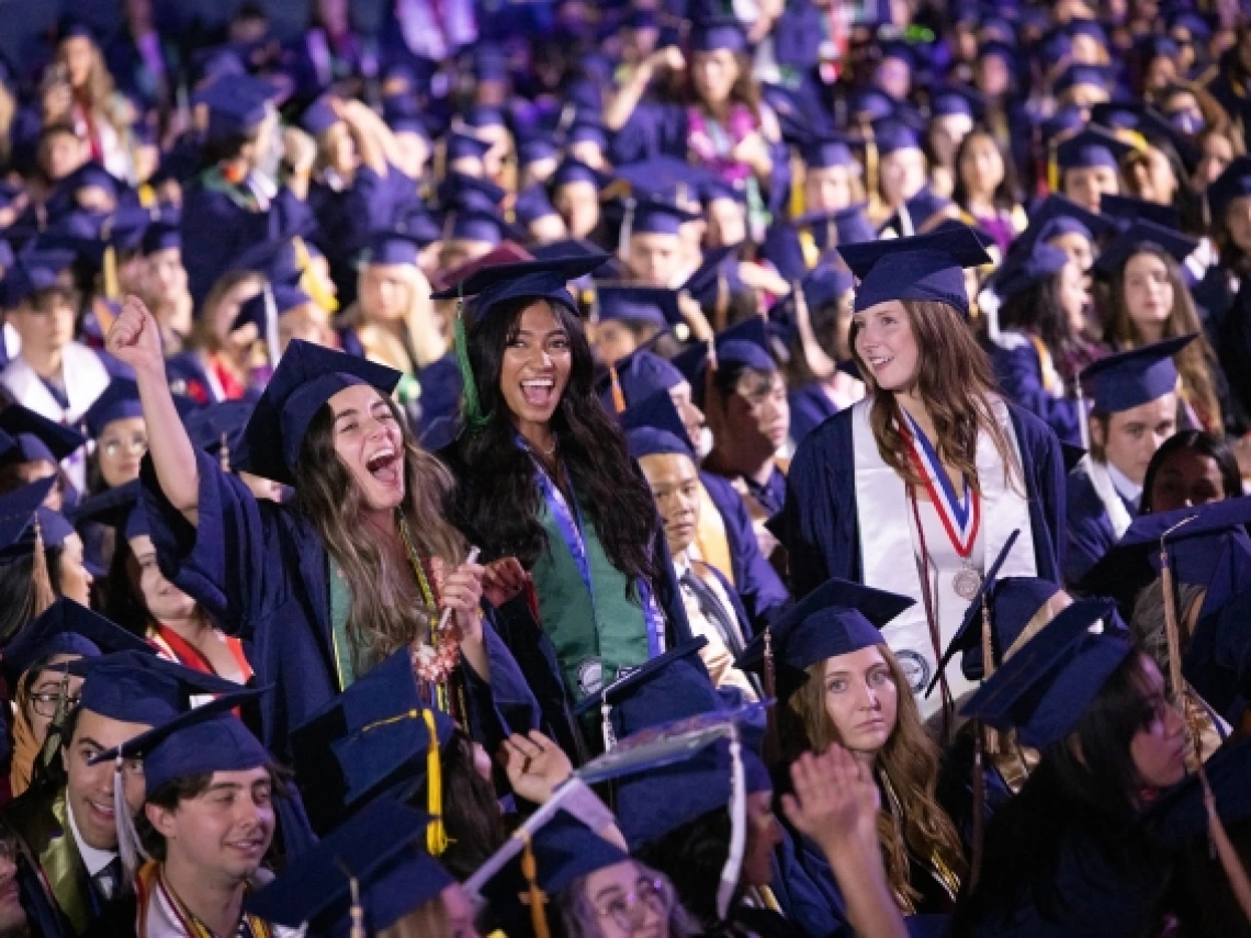 graduates celebrate during commencement