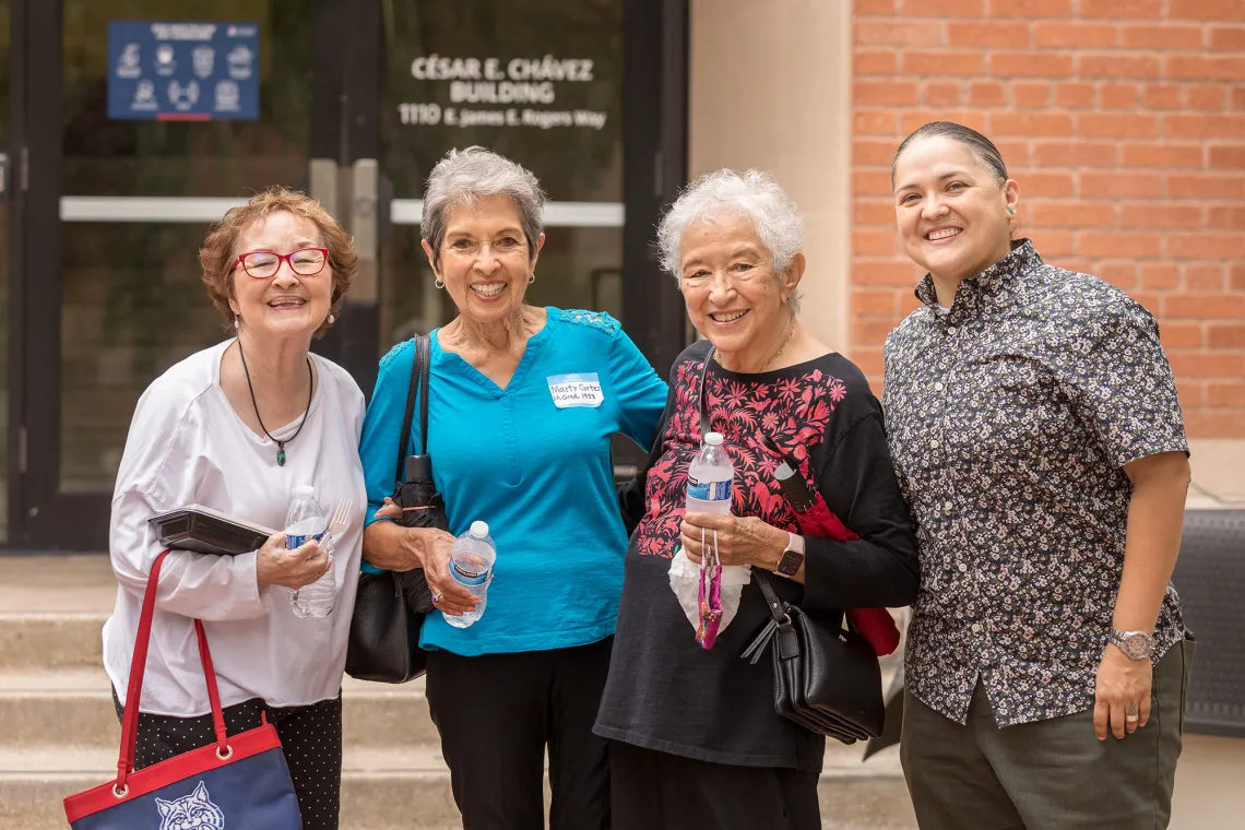 Four women standing together