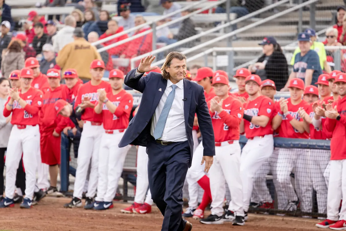 A photograph of Trevor Hoffman waving to fans