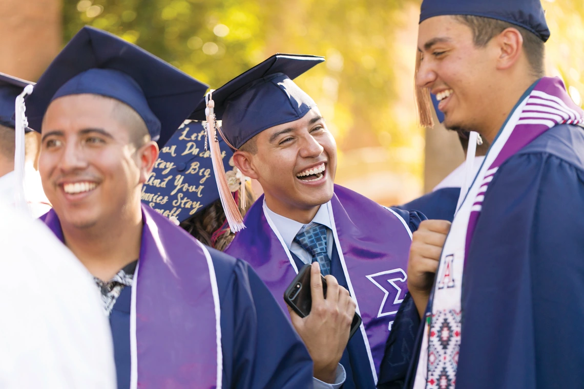 A photograph of Sigma Lambda Beta fraternity members graduating