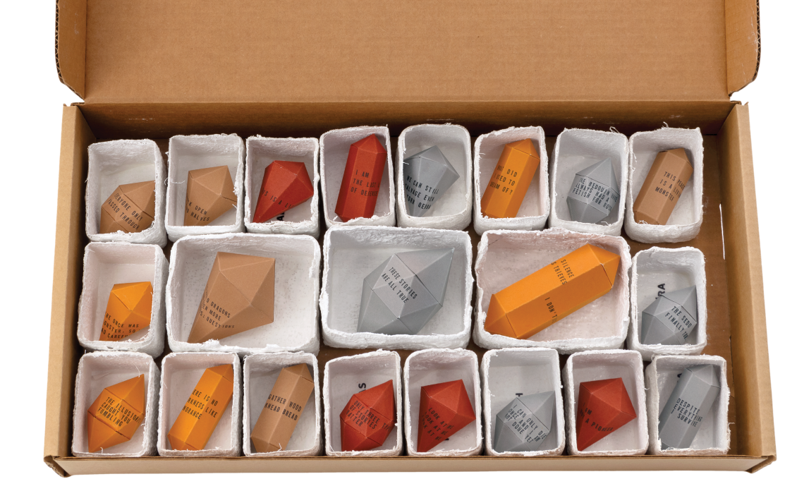 Box containing 21 origami gemstones